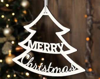 May include: White wooden Christmas tree ornament with the words "Merry Christmas" cut out.