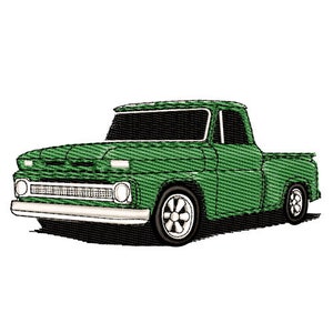 Puede incluir: Una camioneta vintage verde con una parrilla blanca y parachoques cromados. La camioneta tiene un interior negro y un volante blanco.