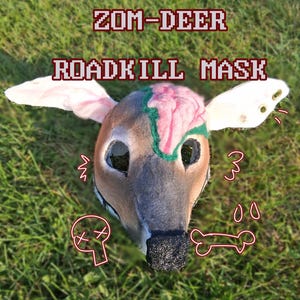 May include: A Zom-Deer Roadkill Mask featuring a brown deer head with a textured black nose, large ears, and a pink brain-like detail on the forehead. The mask includes eye cutouts and white graphic illustrations of a skull and a bone on the surface.