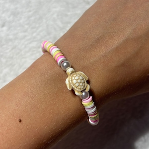 Light pink lemonade turtle charm bracelet-summer bracelet-trendy bracelets for everyday wear.