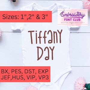 May include: White baby onesie with brown embroidery that reads "Tiffany Day". The onesie is on a wooden surface with pink flowers. The text "Sizes: 1", 2" & 3" is at the top of the image. The text "BX, PES, DST, EXP JEF, HUS, VIP, VP3" is at the bottom of the image.