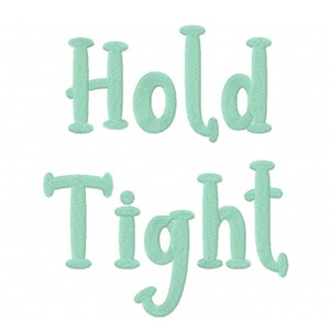 May include: A light green embroidered design that says "Hold Tight" in a whimsical font.
