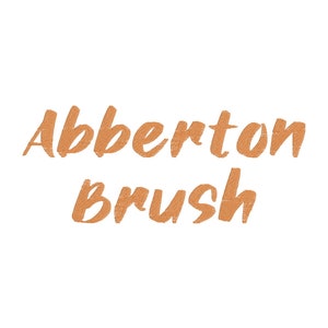 May include: A brush with the text "Abberton Brush" written in a brown, textured font.