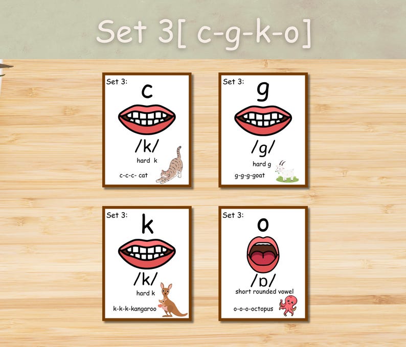 May include: Four flashcards with illustrations for phonics. Each card features a letter (c, g, k, o), a mouth graphic, and a corresponding image (cat, goat, kangaroo, octopus). The text "Set 3" is at the top of each card.