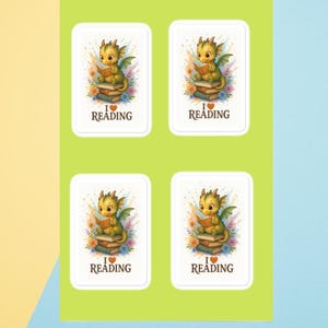 May include: Four rectangular stickers with a cartoon dragon reading a book. The dragon is yellow-green with small wings and is sitting on a stack of books. The text "I ❤️ READING" is below the dragon.