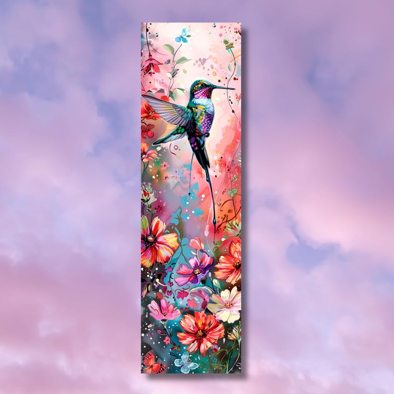 May include: A vibrant hummingbird with iridescent green and purple feathers hovers over a cluster of pink, red, and white flowers. The background is a soft pink watercolor wash.