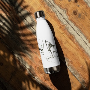 May include: White stainless steel water bottle with a black and white illustration of a wolf howling at the moon. The wolf is surrounded by mountains and trees.