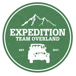 May include: A green circle with a white jeep silhouette, mountains, and the text "EXPEDITION TEAM OVERLAND EST 2017".