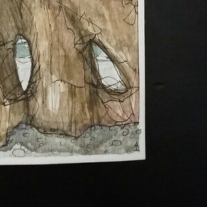 May include: A watercolour painting of a brown rock formation with two white eye-like shapes. The rock formation is painted in a textured style with brown and black lines. The background is a light brown colour.