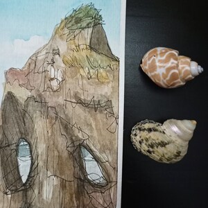 May include: A watercolour painting of a cliff with a small tree on top. The cliff has a cave-like opening with a blue sky visible inside. The painting is on a white background.