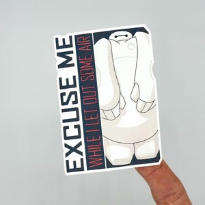 May include: A white sticker featuring a cartoon character with the text "EXCUSE ME WHILE I LET OUT SOME AIR" in black and red. The character is white with black accents and a simple design.