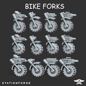 May include: A set of 12 3D printed bike forks for miniature wargaming. The forks are in various poses, with different angles of the handlebars and wheels. The forks are made of a light gray plastic.