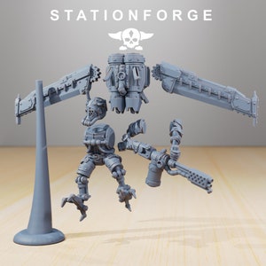 May include: A disassembled model kit of a robot with a skull and crossbones logo. The kit includes a torso, legs, arms, a weapon, and a base.