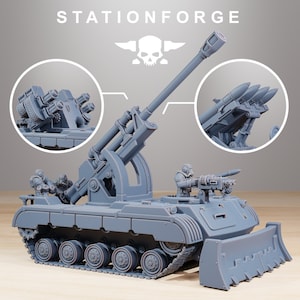 May include: A gray plastic model of a tank with a large cannon and a bulldozer blade. The tank has two figures on top, one holding a gun. The tank is on a wooden surface. The text "STATIONFORGE" is at the top of the image.