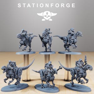 May include: Six gray miniature figurines of robotic dinosaurs ridden by figures in hooded armor. The figurines are on oval bases and are displayed against a gray background. The text "STATIONFORGE" and a skull logo are at the top.