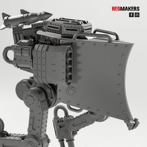 May include: A detailed, gray model of a mechanical war machine, featuring a missile launcher, a large shield, and articulated legs. The design includes rivets, vents, and a handle. The text "REDMAKERS" is visible.