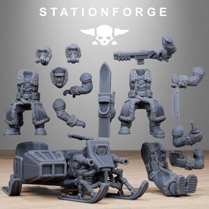 May include: A collection of gray miniature figurines and a snowmobile. The figurines include various body parts, such as arms, legs, and torsos, along with a few heads and a weapon. The snowmobile has a detailed design with skis and a front-mounted gun. The text "STATIONFORGE" is at the top.