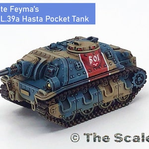 May include: A blue and brown miniature tank with a red and white stripe and the number 501 on the side. The tank is painted with a weathered look and has a small cannon on the front. The tank is on a white background.