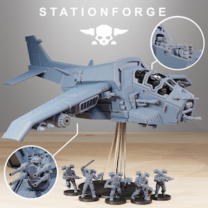May include: A gray plastic model of a spaceship with a skull logo on the side. The spaceship is hovering above a base with six gray plastic figures of soldiers. The text "STATIONFORGE" is printed on the background.