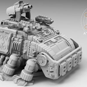 May include: A detailed, light gray model of a futuristic armored vehicle. The model features multiple turrets, hatches, and intricate mechanical details. The text "ATLAN FORGE" is visible on the right side of the image. This model is likely for tabletop gaming or display.