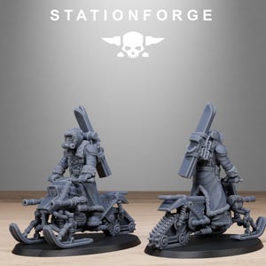 May include: Two gray miniature figures of a person riding a snowmobile. The figures are wearing winter coats, goggles, and carrying skis. The snowmobiles have tracks and skis. The text "STATIONFORGE" is at the top.
