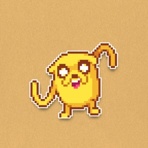 May include: A pixelated yellow cartoon dog sticker with a white outline. The dog has a smiling expression with its tongue sticking out. The sticker is on a tan background.