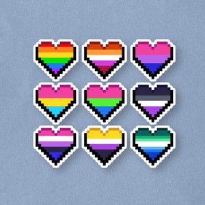 May include: Nine pixelated heart stickers with white borders, each featuring a different LGBTQ+ pride flag design. The flags include rainbow, lesbian, bisexual, transgender, pansexual, asexual, non-binary, and genderqueer flags.