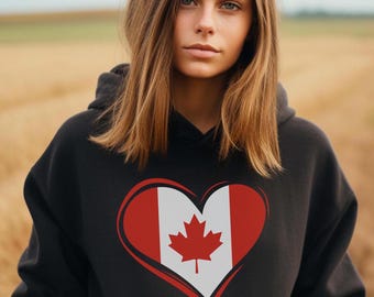 May include: Black hoodie with a red heart featuring the Canadian flag. The heart is outlined in white.
