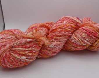 Hand-dyed hand-spun worsted weight merino yarn with silk slubs