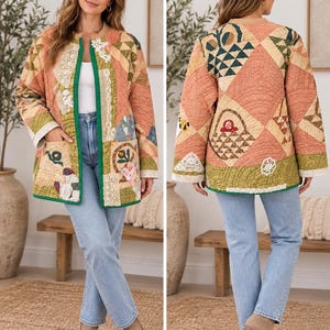 May include: A quilted jacket featuring a patchwork design in shades of peach, green, and cream. The garment has a collarless neckline, long sleeves, two front pockets, and a green trim. The fabric displays various geometric patterns and lace accents.
