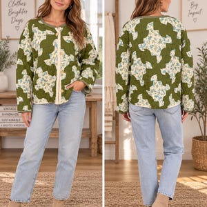 May include: A long-sleeve quilted jacket featuring a patchwork pattern of solid olive green fabric and a cream-colored floral print with small blue flowers. The jacket has a round neckline, a button-front closure, and light blue denim jeans.