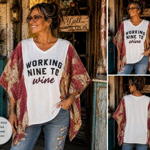 May include: A white V-neck top with the black and maroon text "WORKING NINE TO wine" printed on the front. The garment features wide, short sleeves made from a patterned fabric in shades of maroon, gold, and brown with a visible stitched texture.