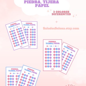 May include: A printable game board for the game Rock, Paper, Scissors. The board has 4 different quantities of each symbol, with 3 different colors. The board is pink, blue, and purple. The text on the board says "Piedra, Tijera, Papel" which is Spanish for Rock, Paper, Scissors.