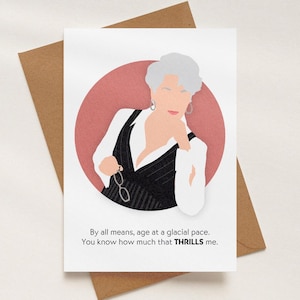 May include: Greeting card featuring a stylized illustration of a woman in a black and white pinstripe vest and white shirt, set against a pink circle. The card includes the text: "By all means, age at a glacial pace. You know how much that THRILLS me."