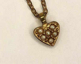 Vintage Avon  circa 1980 gold tone small, dainty heart shaped pendant with 6 faux seed pearls