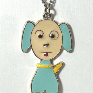Vintage, flat enameled blue cartoon dog pendant on 18” silvertone chain. Unmarked