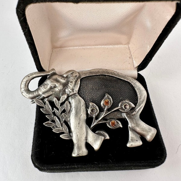 Vintage Kenneth Cole silver tone metal elephant brooch with mesh body.