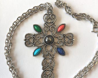 Beautiful large circa 1976 marked Avon cross. silver toned and multi color enamel