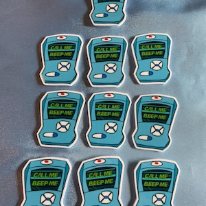 May include: Nine blue and white pager stickers with the text "CALL ME BEEP ME" in green. The stickers are arranged in three rows of three.