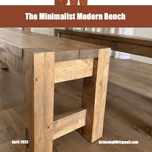 Puede incluir: Primer plano de un banco de madera con un diseño minimalista. El banco está construido con gruesas tablas de color marrón claro y tiene una apariencia robusta y cuadrada. El texto "The Minimalist Modern Bench" se muestra encima del banco.