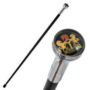 May include: A black walking stick featuring a silver-toned handle with a circular top. The handle displays a colourful emblem with two golden horses, a red eagle, and the text Unity and Faith set against a black background with silver detailing.