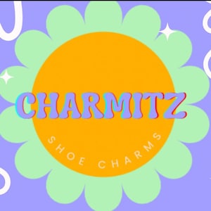 May include: A graphic design featuring the word "CHARMITZ" in a retro font, with a blue and red outline, set against a yellow circle and a light green flower shape. The words "SHOE CHARMS" are in a circle around the yellow circle, with a purple background.
