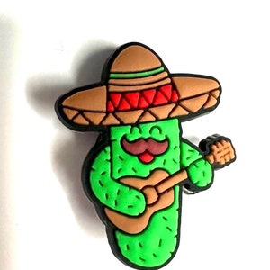 May include: A green cactus wearing a brown sombrero with red accents and a moustache, playing a brown guitar.
