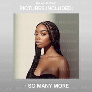 May include: A woman with dark skin and black braids poses for a photo. She is wearing a black strapless top. The background is a light gray wall.