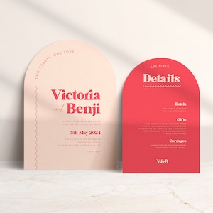May include: Two pink and red arch-shaped wedding invitation cards with the text "Two Hearts, One Love" and "Victoria and Benji are getting married and would love for you to join the party" on the left card and "The Finer Details" with headings "Hotels", "Gifts", and "Carriages" on the right card.
