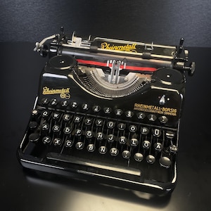 Máquina de escribir portátil vintage Rheinmetall de 1962 (número de serie: 269562), totalmente funcional, con mantenimiento y limpieza, estado de 4 estrellas.