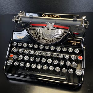 Máquina de escribir antigua portátil Continental 340 (1936) – Negro brillante, estado impecable