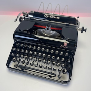 Vintage typewriter -High gloss black- Optima Elite (1953) – A Timeless German Masterpiece
