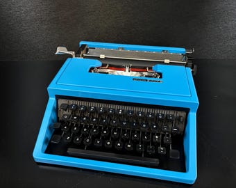 Máquina de escribir Olivetti Dora vintage, teclado QWERTY, en funcionamiento, revisada y limpiada, estado 4 estrellas + estuche, reacondicionada.