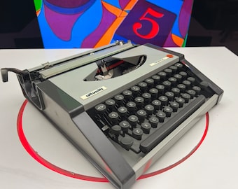 Vintage 1984 Olivetti Tropical Portable Typewriter in Warm Gray - A Design Classic